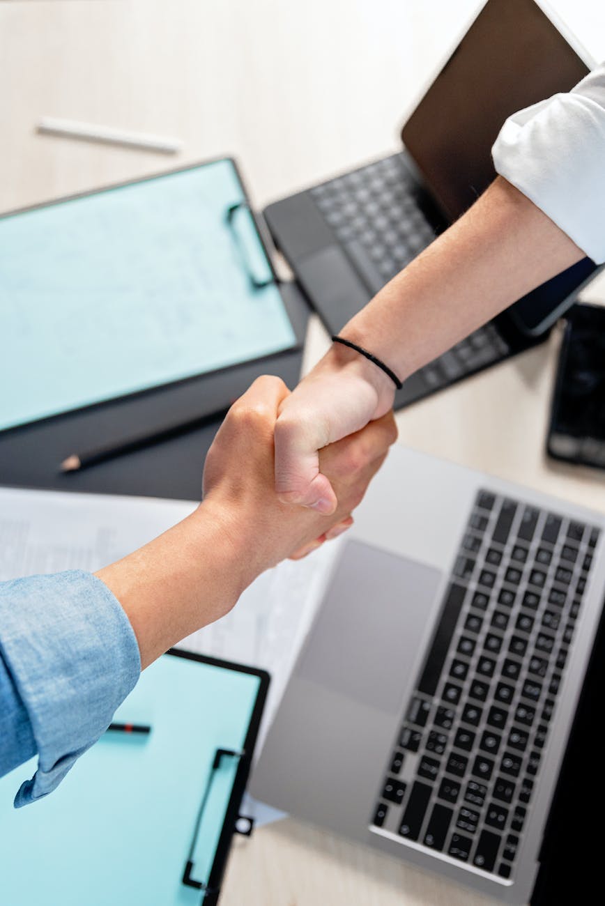 high angle shot of a people doing shaking hands